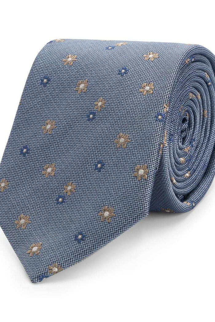 Stropdas zijde bloem blauw met glanzend bloemendessin op een lichtblauwe achtergrond.