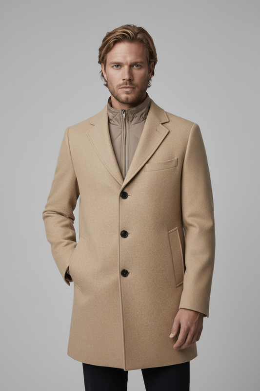 Coat windvanger camel worn by a model, showcasing its modern design and integrated windbreaker features.