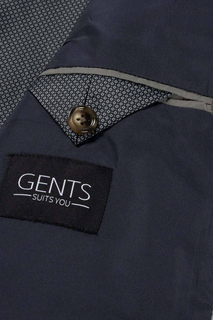 Detail van Colbert stretch cord grijs met knop en merkenlabel, geschikt voor herenmode.
