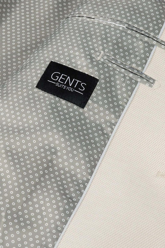 Colbert stretch pique zand detail with GENTS label and patterned fabric interior.