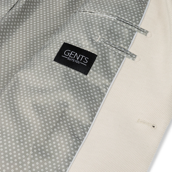 Colbert stretch pique zand detail of inner lining and label GENTS for stylish custom fit.
