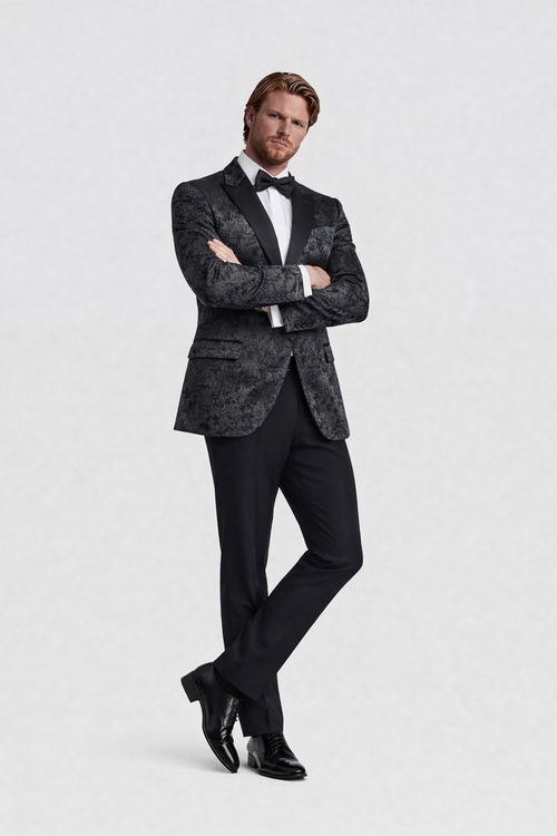 Man wearing a Dinnerjacket paisley velvet zwart with satin shawl collar and refined lining.