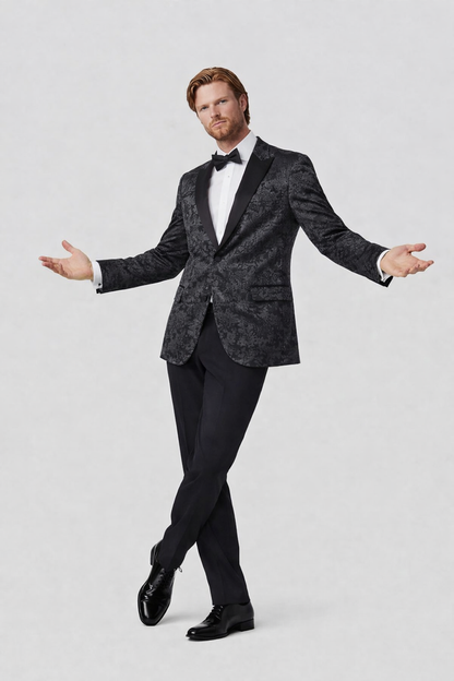 Dinnerjacket paisley velvet zwart worn by a man in a sophisticated pose, featuring a satin shawl collar.