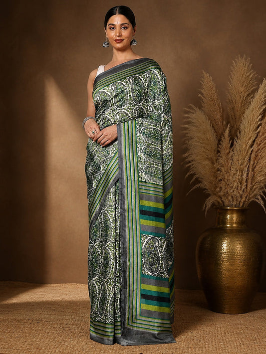 White, green and dark grey paisley printed saree with alternating striped panels, styled with a reference blouse.