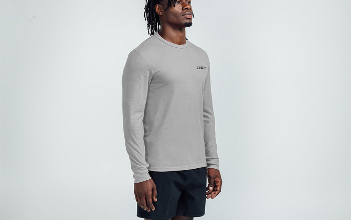 The REP Fitness Men's REP® Long-Sleeve Tri-Blend Crew T-Shirt in Heather Gray/Black on body