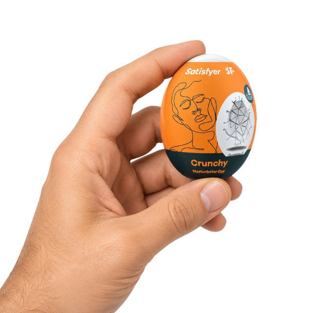 Ou masturbator SATISFYER Crunchy Egg, de unică folosință, interior texturat, material flexibil TPE (portocaliu)&nbsp;
