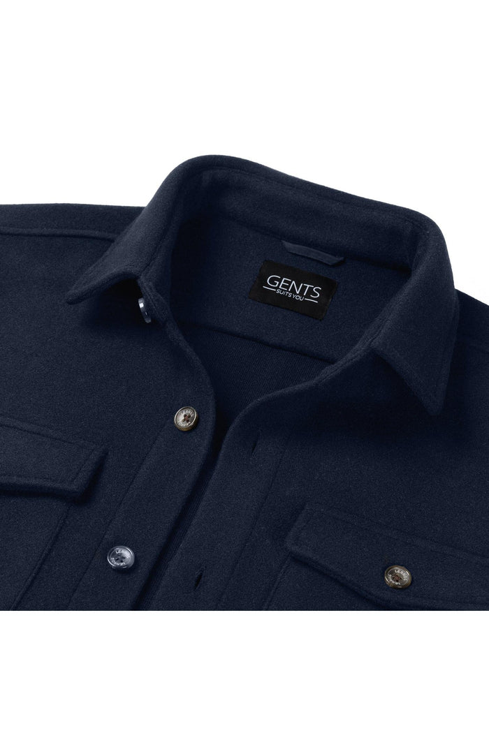 Overshirt navy close-up with two chest pockets, GENTS label, and button closure.