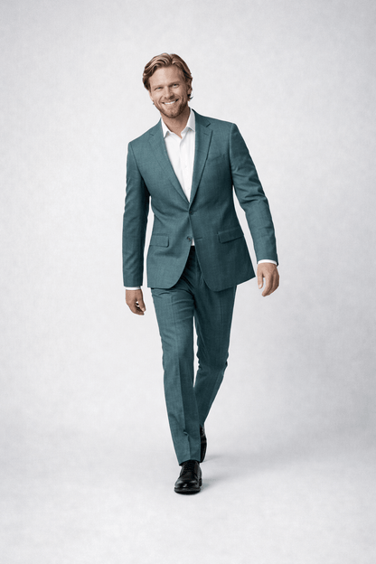 Man wearing Pak 2-delig Midnight Teal, a modern dark teal suit with a tailored fit.
