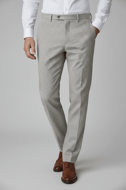 Pantalon pied-de-poule beige met kenmerkende structuur, perfect voor een stijlvolle look.