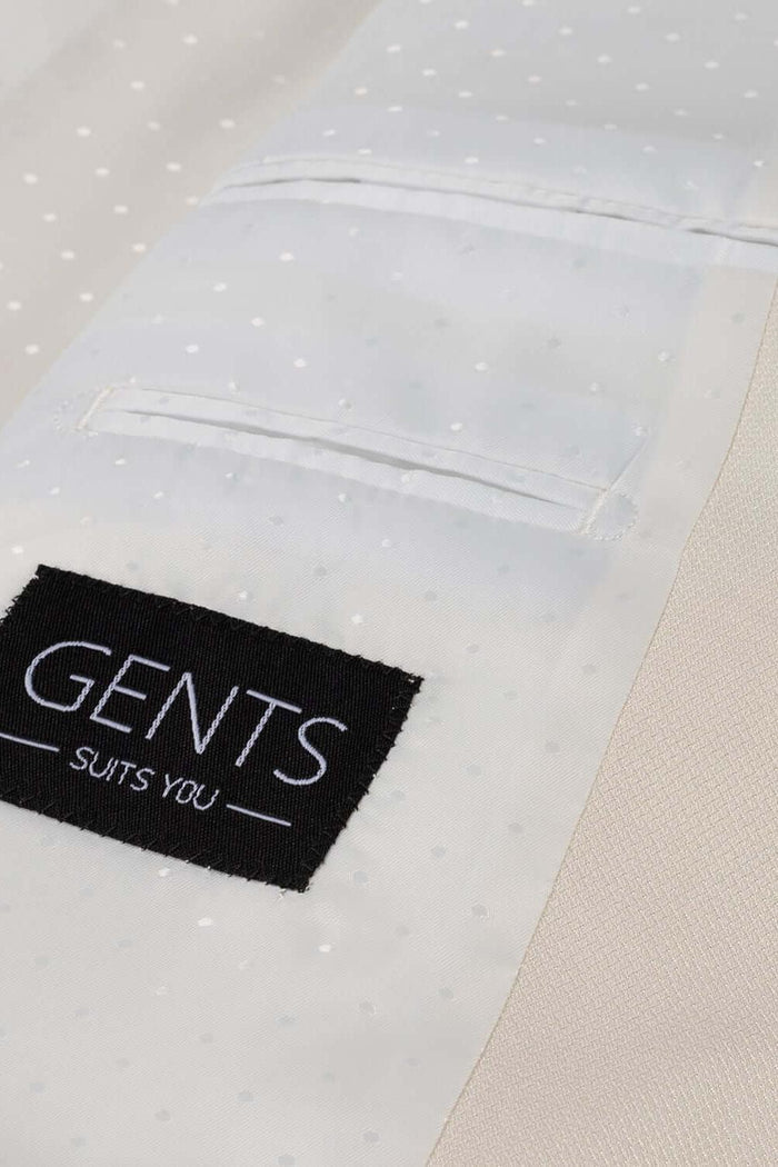 Detail of a stylish Pak ivoorwit 2-delig suit fabric with polka dots and GENTS label.