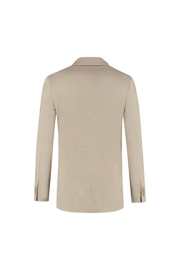 A stylish back view of a Pak stretch dune beige jacket with fine finishing details.
