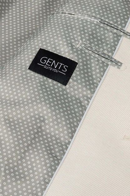 Pak Stretch Piqué Zand 2-delig met op de binnenkant 'Gents suits you' label en motief.