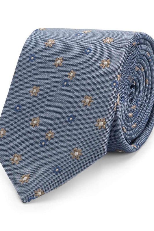 Stropdas zijde bloem blauw met glanzend bloemendessin op een lichtblauwe achtergrond.