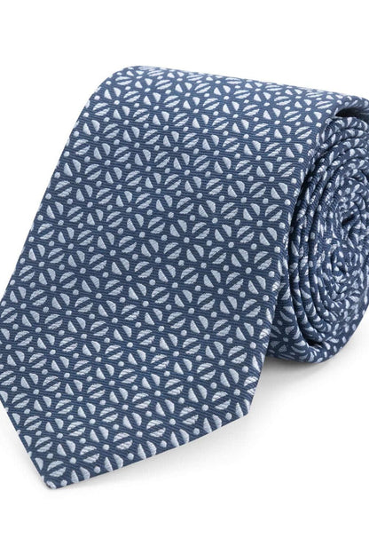 Stropdas zijde patronen donkerblauw met subtiel bloemenpatroon in een elegante afwerking.