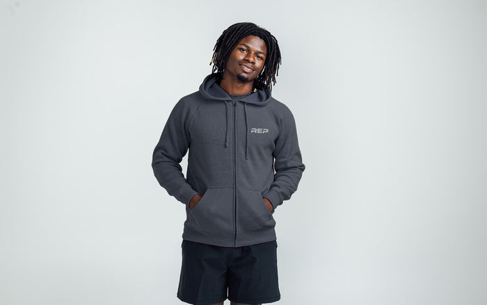 The REP Fitness Unisex Zip Hoodie in Heather Navy/Silver on body