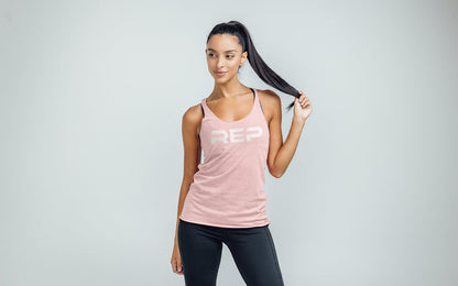The REP Fitness Women's Daily Driver Tri-Blend Tank in Heather Rose/White on body